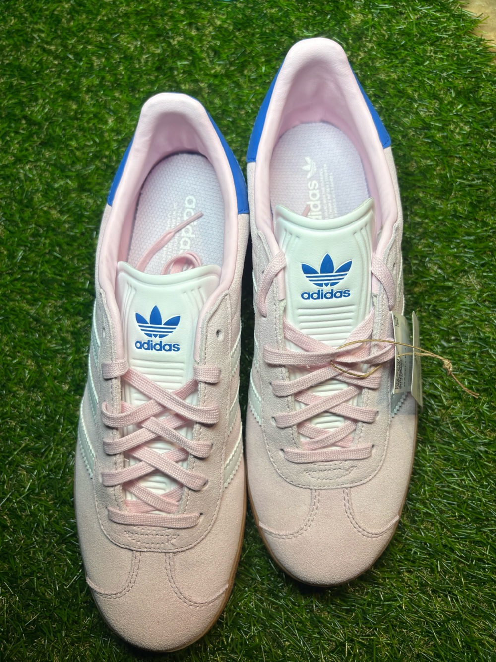 Adidas Gazelle Suede Sneakers in Light Pink with white Stripes and a blue heel. - Picture 4 of 8